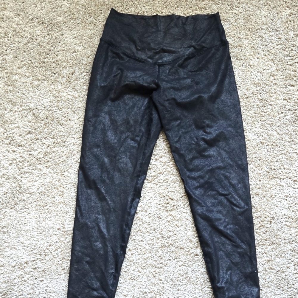 Black Shiny Leggings. Size large. Crosses at waist